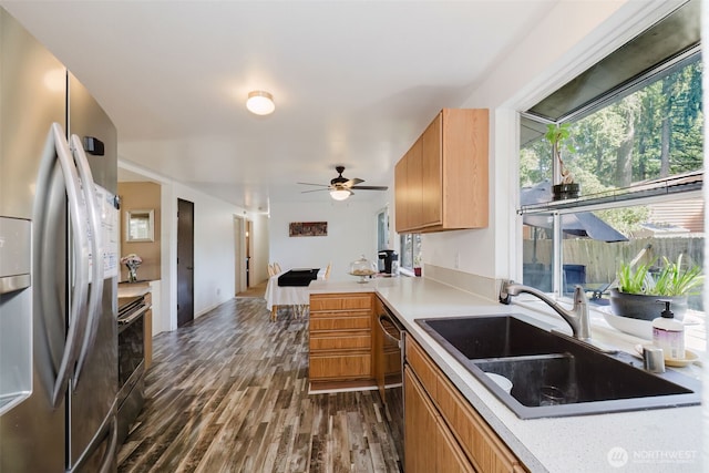3160 SE Pierson St, Port Orchard, WA 98366 - kitchen with stainless steel appliances, a sink, light countertops, and dark wood finished floors