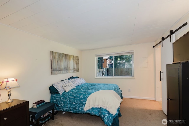 3160 SE Pierson St, Port Orchard, WA 98366 - carpeted bedroom featuring a barn door and baseboards