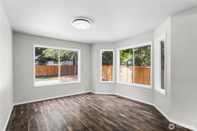 10901 194th Street Ct E, Graham, WA 98338 - spare room featuring dark wood finished floors and baseboards