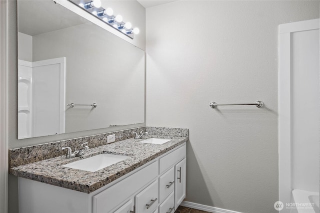 10901 194th Street Ct E, Graham, WA 98338 - bathroom with double vanity and baseboards