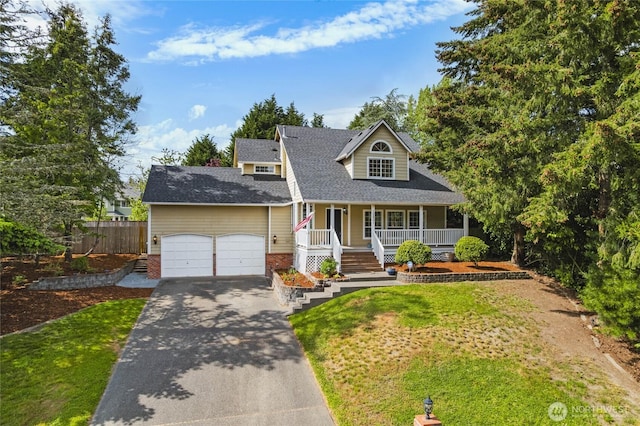 10901 194th Street Ct E, Graham, WA 98338 - view of front facade with a porch, an attached garage, driveway, and a shingled roof