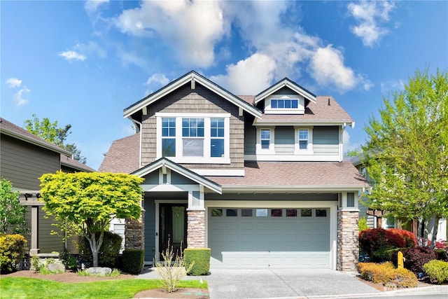 6611 Waterton Cir, Mukilteo, WA 98275 - craftsman inspired home with a garage, driveway, roof with shingles, and stone siding