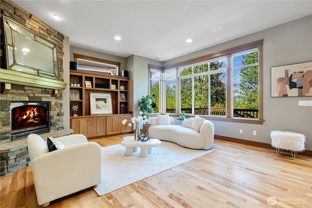 6611 Waterton Cir, Mukilteo, WA 98275 - living room featuring a fireplace, baseboards, light wood-type flooring, and recessed lighting