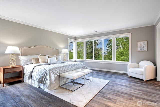 6611 Waterton Cir, Mukilteo, WA 98275 - bedroom featuring crown molding, baseboards, and wood finished floors