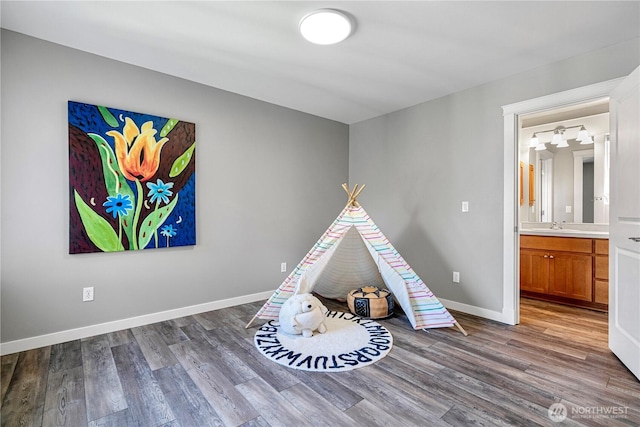 6611 Waterton Cir, Mukilteo, WA 98275 - game room with wood finished floors, baseboards, and a sink
