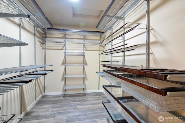 6611 Waterton Cir, Mukilteo, WA 98275 - spacious closet featuring wood finished floors