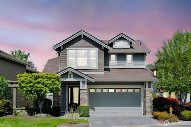 6611 Waterton Cir, Mukilteo, WA 98275 - craftsman-style house featuring a garage, concrete driveway, stone siding, and a shingled roof