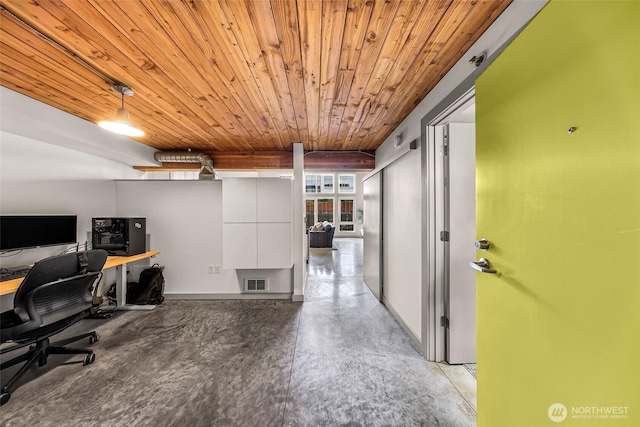 unfurnished office featuring wood ceiling, concrete floors, and baseboards