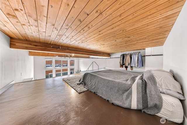 bedroom with finished concrete flooring and wooden ceiling