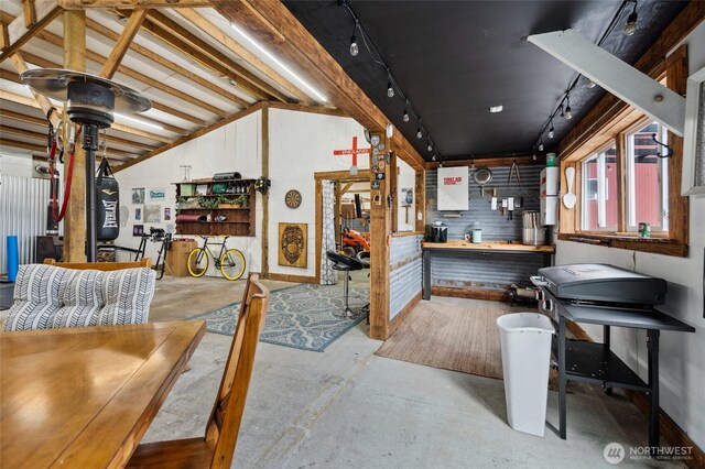 6515 Lawrence Rd, Everson, WA 98247 - misc room featuring track lighting, concrete floors, vaulted ceiling, and a workshop area