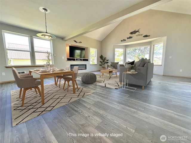 12 Diamond Dr, Pacific Beach, WA 98571 - dining space with wood finished floors, high vaulted ceiling, and beamed ceiling
