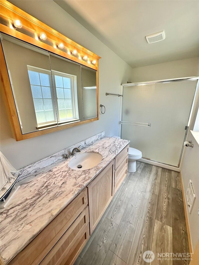 12 Diamond Dr, Pacific Beach, WA 98571 - full bath featuring wood finished floors, vanity, and an enclosed shower