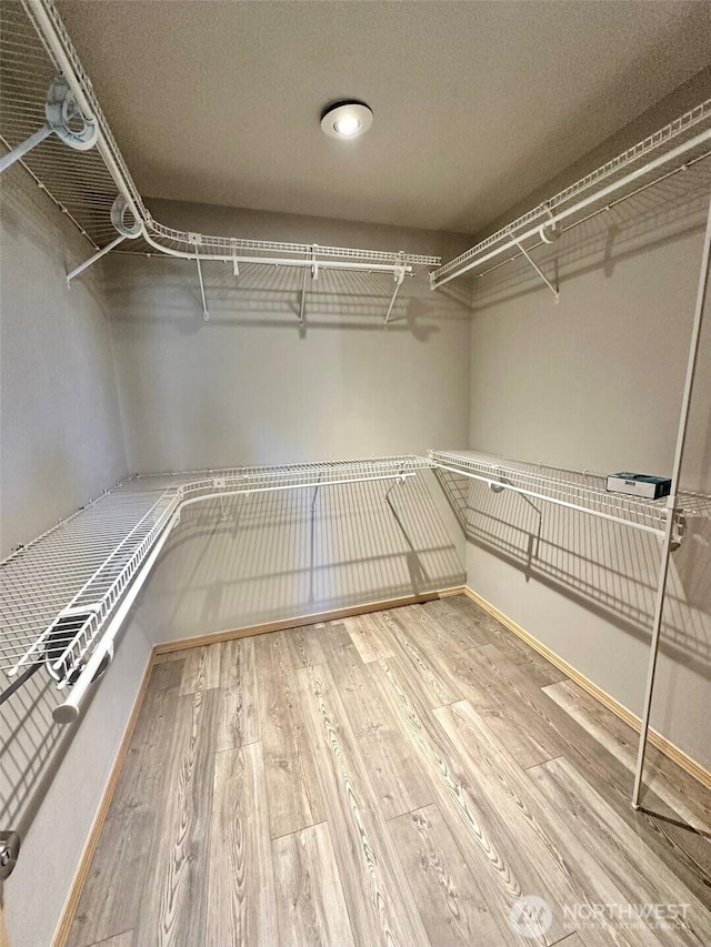 12 Diamond Dr, Pacific Beach, WA 98571 - walk in closet featuring wood finished floors