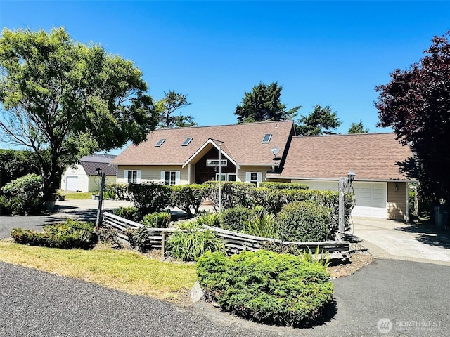 12 Diamond Dr, Pacific Beach, WA 98571 - view of front of house featuring concrete driveway and an attached garage