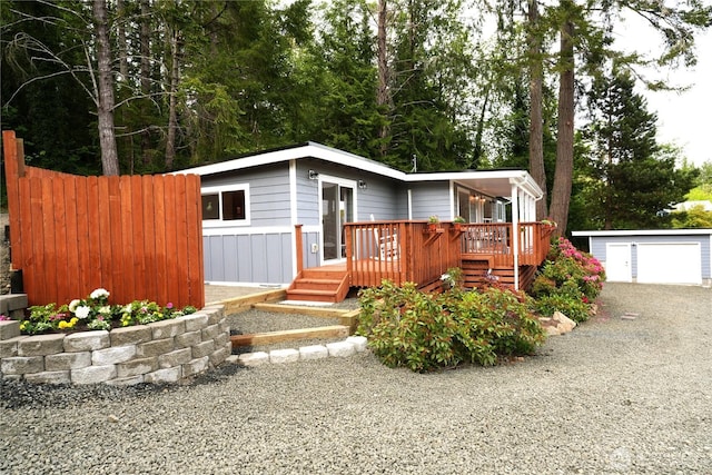 340 N Terrace Rd, Hoodsport, WA 98548 - view of front facade featuring a deck, an outbuilding, and a detached garage