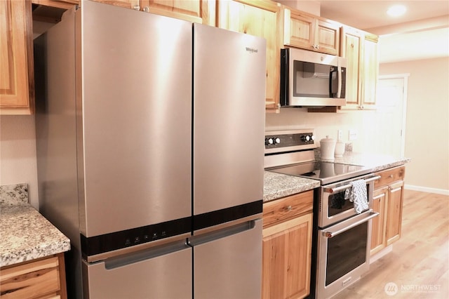 340 N Terrace Rd, Hoodsport, WA 98548 - kitchen featuring stainless steel appliances, light brown cabinets, light wood finished floors, baseboards, and recessed lighting