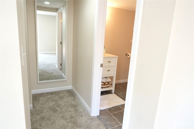 340 N Terrace Rd, Hoodsport, WA 98548 - hallway featuring baseboards, tile patterned floors, and carpet