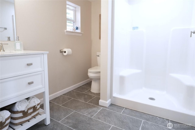 340 N Terrace Rd, Hoodsport, WA 98548 - bathroom featuring toilet, tile patterned flooring, a stall shower, baseboards, and vanity