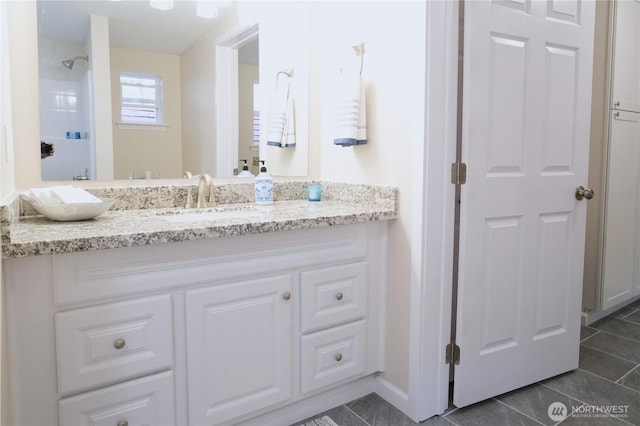 340 N Terrace Rd, Hoodsport, WA 98548 - bathroom with tile patterned floors, vanity, baseboards, and a shower