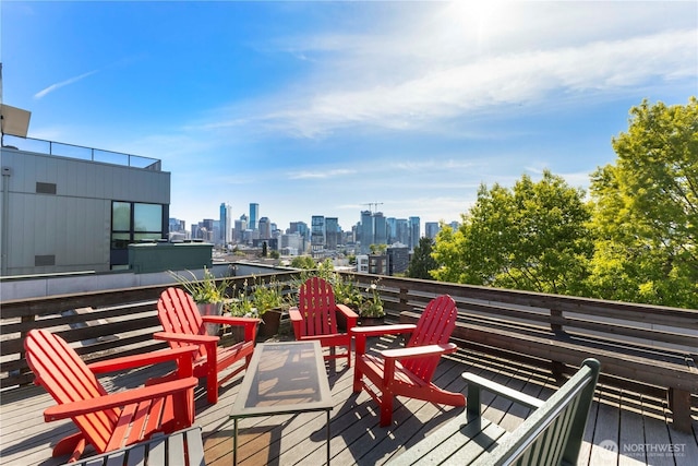 705 E Republican St Unit 207, Seattle, WA 98102 - wooden terrace with a view of skyline