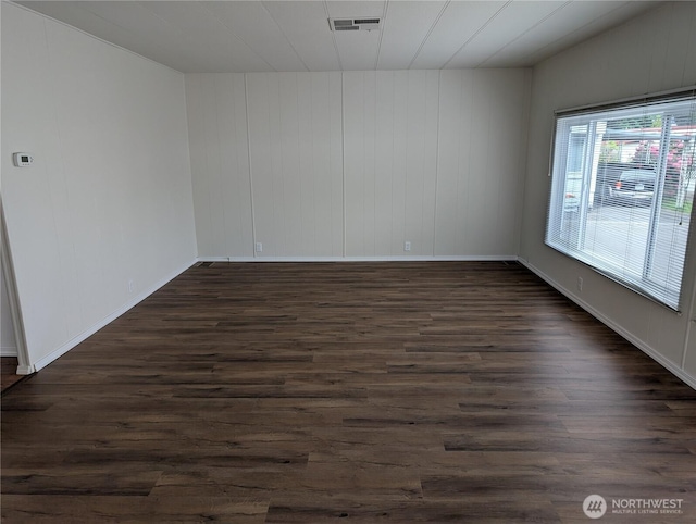 2302 R St SE Unit 128, Auburn, WA 98002 - spare room with dark wood finished floors and baseboards