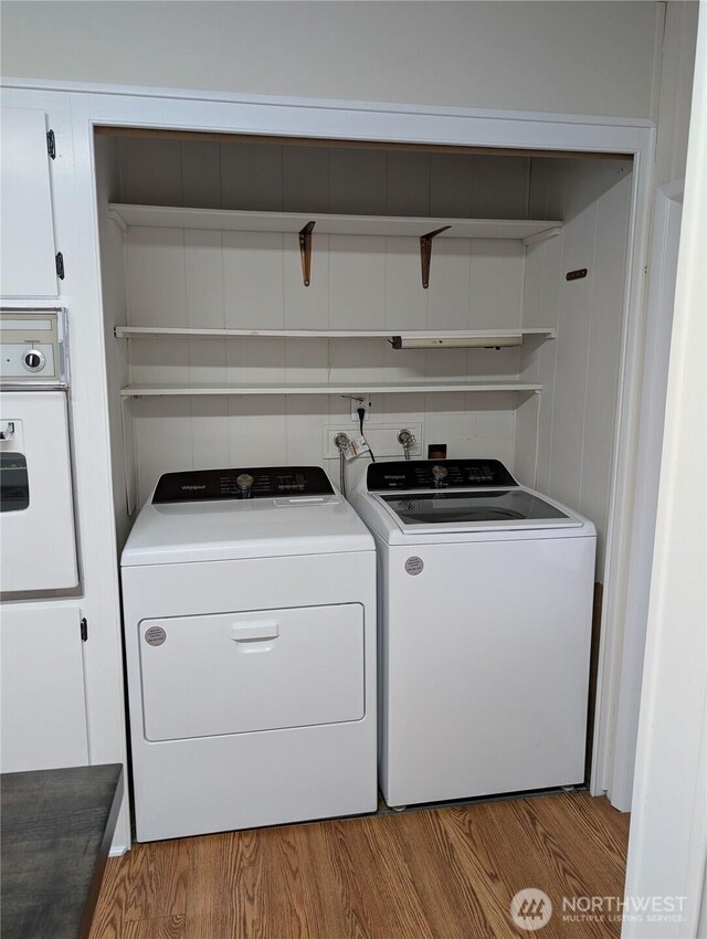 2302 R St SE Unit 128, Auburn, WA 98002 - laundry area with washer and dryer and wood finished floors
