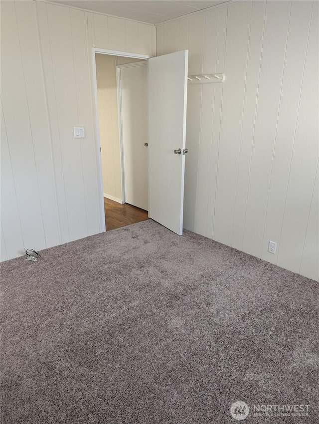 2302 R St SE Unit 128, Auburn, WA 98002 - unfurnished room featuring carpet and a decorative wall
