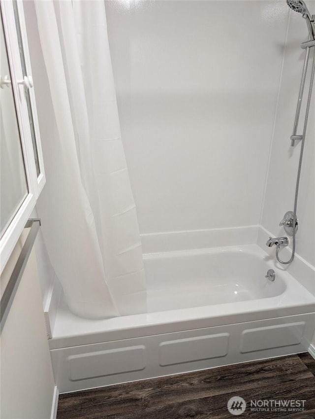 2302 R St SE Unit 128, Auburn, WA 98002 - full bathroom featuring shower / bath combination with curtain and wood finished floors