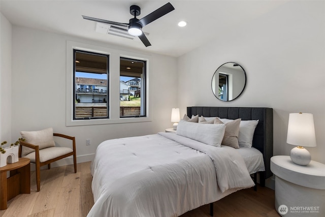 bedroom featuring light wood-type flooring, baseboards, recessed lighting, and a ceiling fan