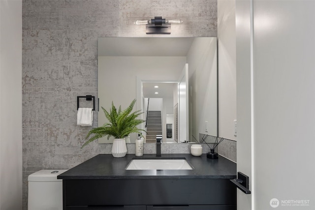 bathroom with vanity and toilet