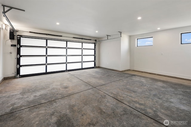 garage featuring baseboards and recessed lighting