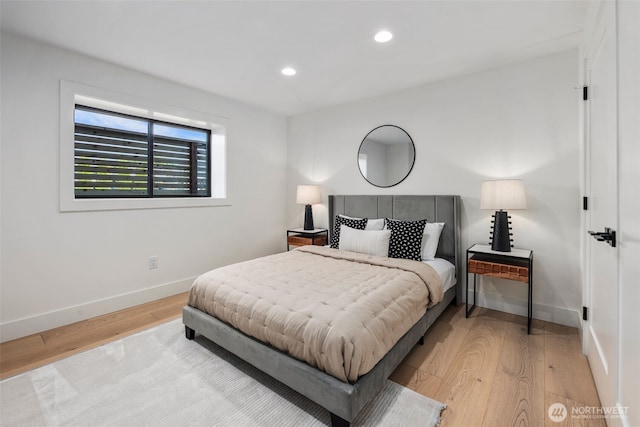bedroom featuring light wood-style floors, baseboards, and recessed lighting