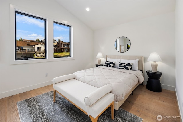 bedroom featuring baseboards, vaulted ceiling, wood finished floors, and recessed lighting
