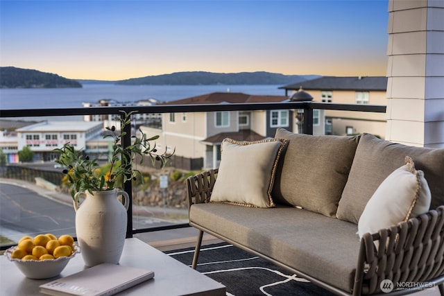balcony at dusk with a mountain view