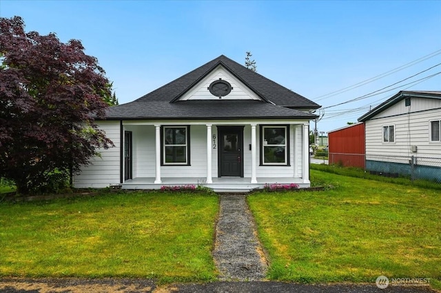 view of front of property with a porch and a shingled roof
