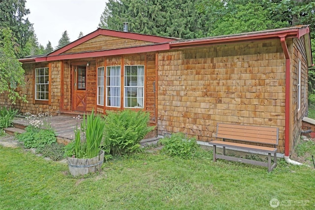472 Iris Ln, Camano Island, WA 98282 - view of side of property with a lawn and a deck