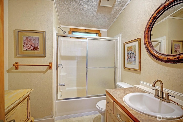 472 Iris Ln, Camano Island, WA 98282 - full bathroom featuring a textured ceiling, toilet, a textured wall, vanity, and enclosed tub / shower combo