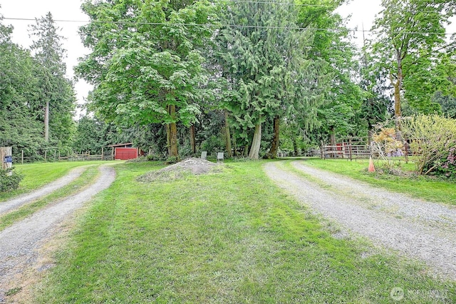 472 Iris Ln, Camano Island, WA 98282 - view of dirt / gravel road featuring a pole building