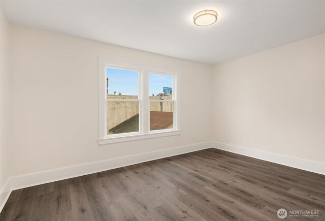 816 N 43rd St, Seattle, WA 98103 - spare room with dark wood finished floors and baseboards