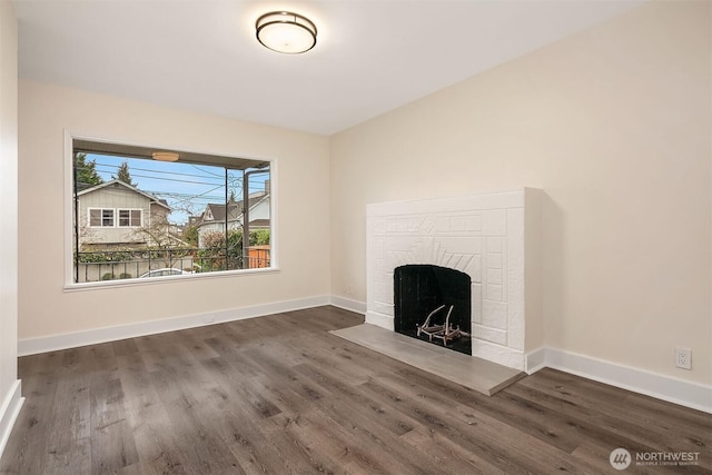 816 N 43rd St, Seattle, WA 98103 - unfurnished living room featuring wood finished floors, a fireplace, and baseboards