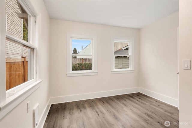 816 N 43rd St, Seattle, WA 98103 - unfurnished room with wood finished floors and baseboards