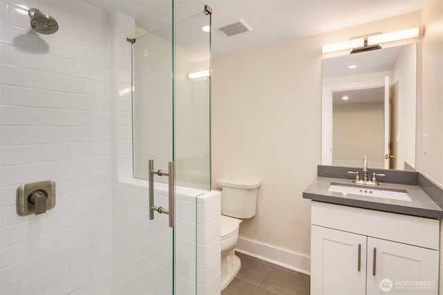 816 N 43rd St, Seattle, WA 98103 - bathroom with a shower stall, toilet, vanity, baseboards, and tile patterned flooring