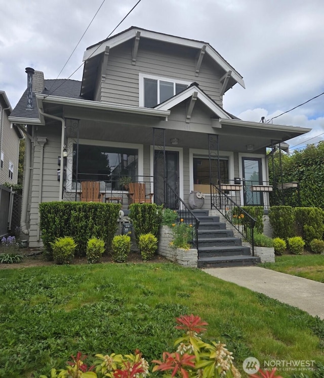 816 N 43rd St, Seattle, WA 98103 - view of front of house with a porch, a front yard, and a chimney