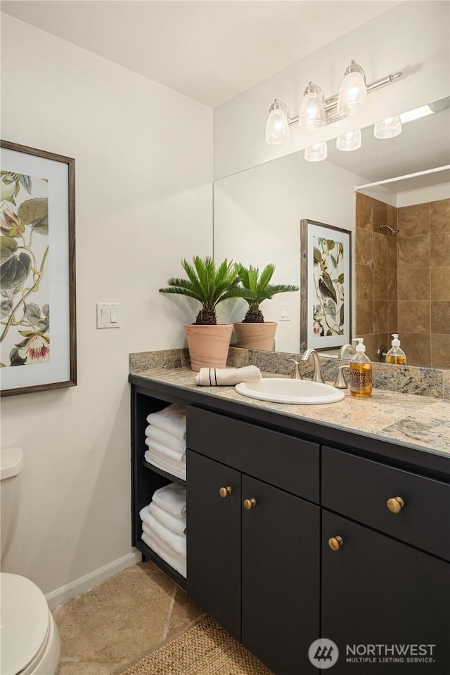2501 Canterbury Ln E Unit 318, Seattle, WA 98112 - full bath with toilet, vanity, baseboards, and a shower