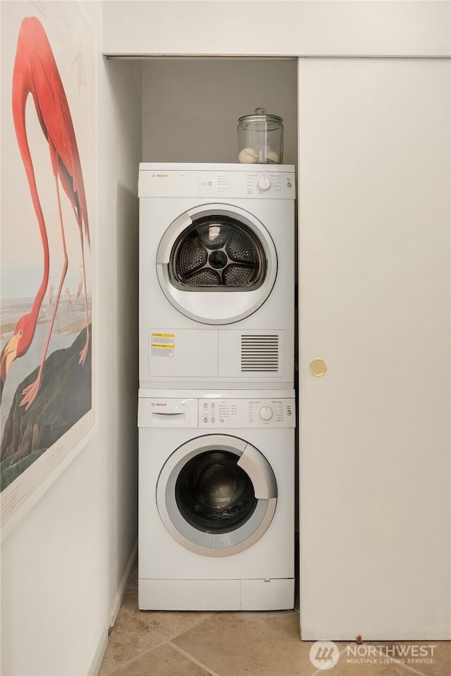 2501 Canterbury Ln E Unit 318, Seattle, WA 98112 - laundry room with stacked washer / drying machine and baseboards