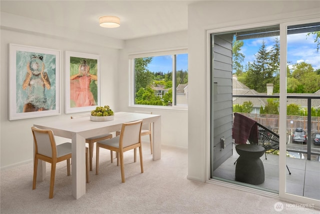 2501 Canterbury Ln E Unit 318, Seattle, WA 98112 - carpeted dining room with baseboards