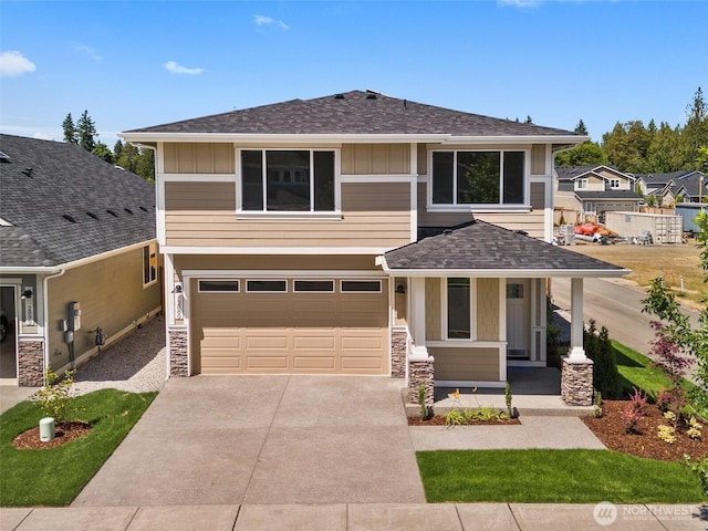 2880 75th Ave SW Lot 62, Tumwater, WA 98512 - view of front of property with a porch, an attached garage, board and batten siding, and concrete driveway