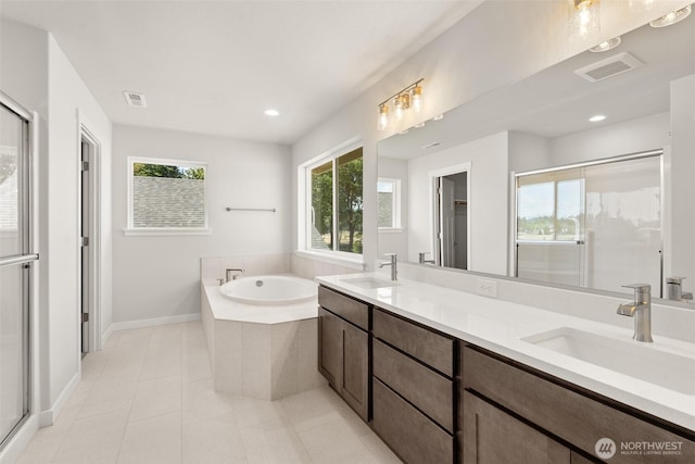 2880 75th Ave SW Lot 62, Tumwater, WA 98512 - bathroom with a garden tub, double vanity, tile patterned flooring, a stall shower, and recessed lighting