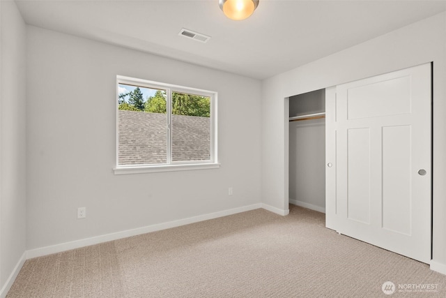 2880 75th Ave SW Lot 62, Tumwater, WA 98512 - unfurnished bedroom featuring light colored carpet and a closet