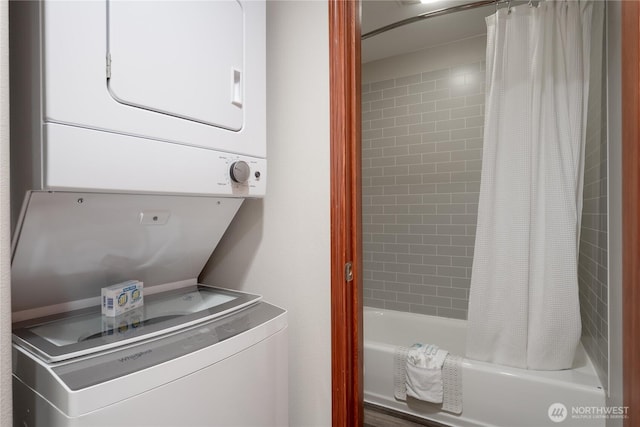 laundry area with stacked washer / dryer
